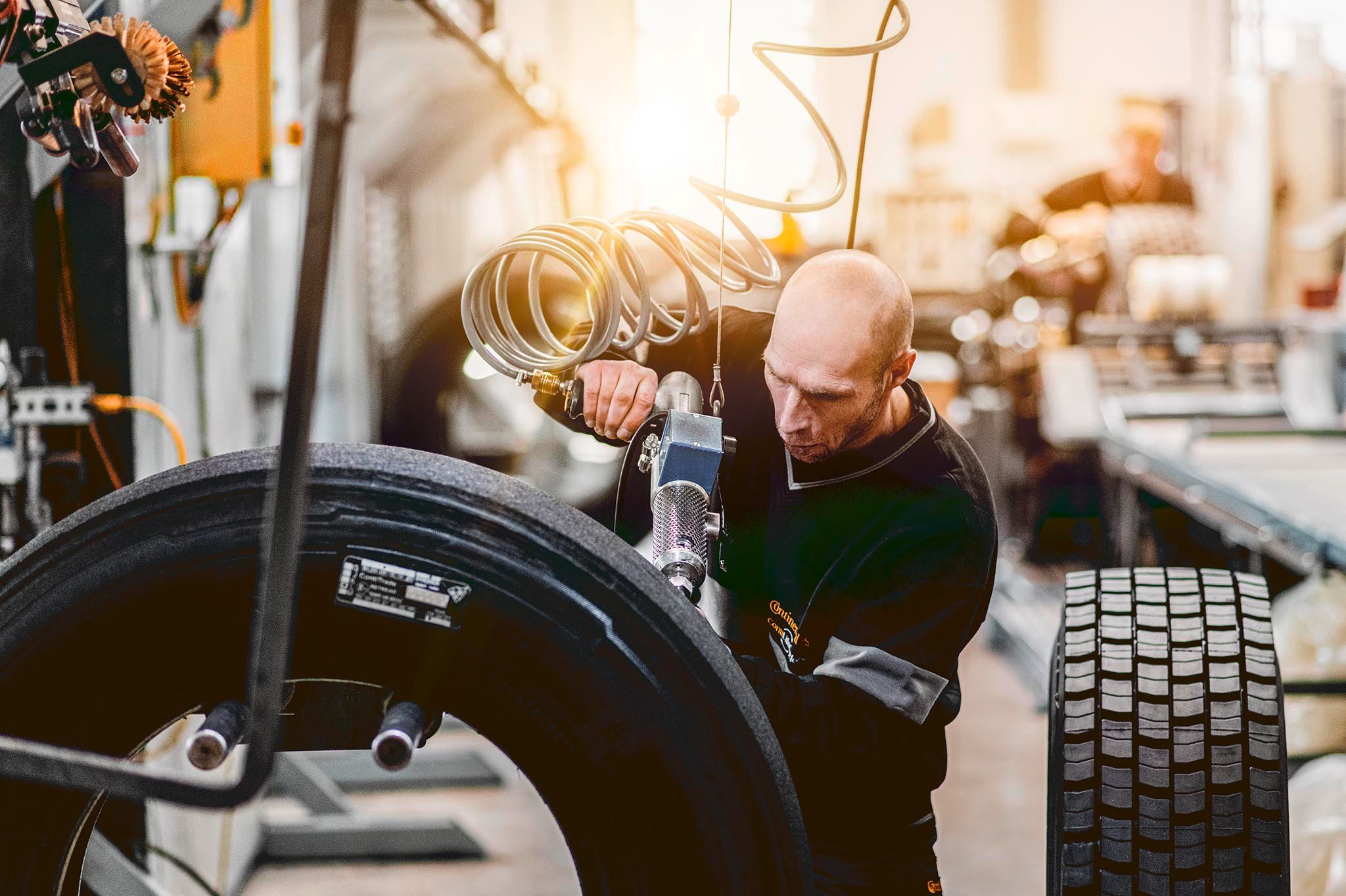 Mechanic preparing a tire for retreading 