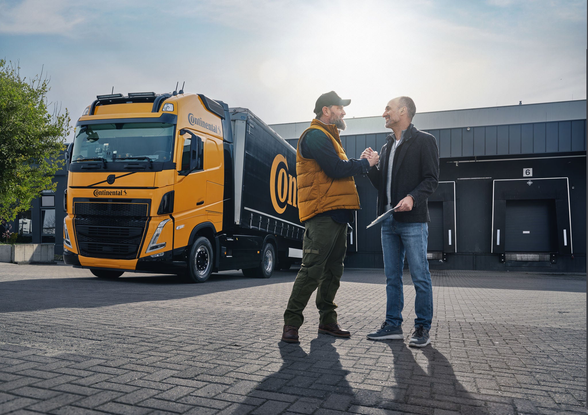 Truck Driver and Logistician outside Truck Driver and Logistician outside of a warehouse