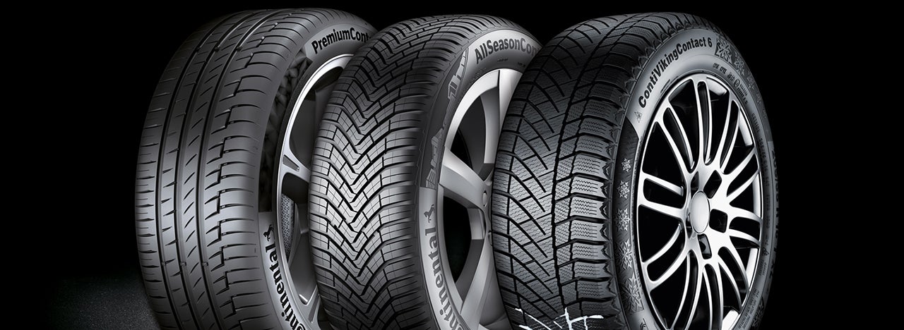 Three Continental tires on black background.