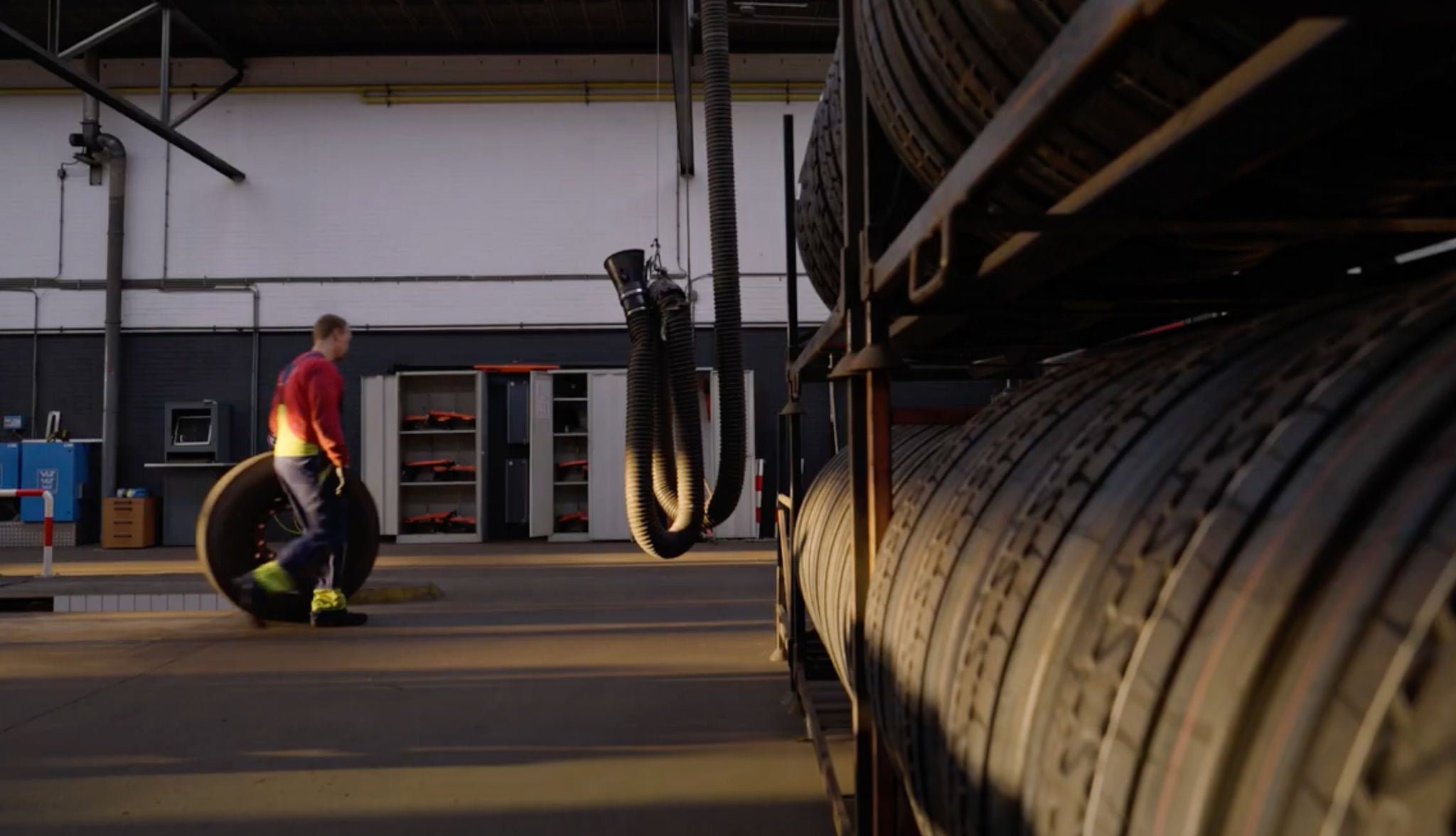 Hartog1 An employee storing truck tires