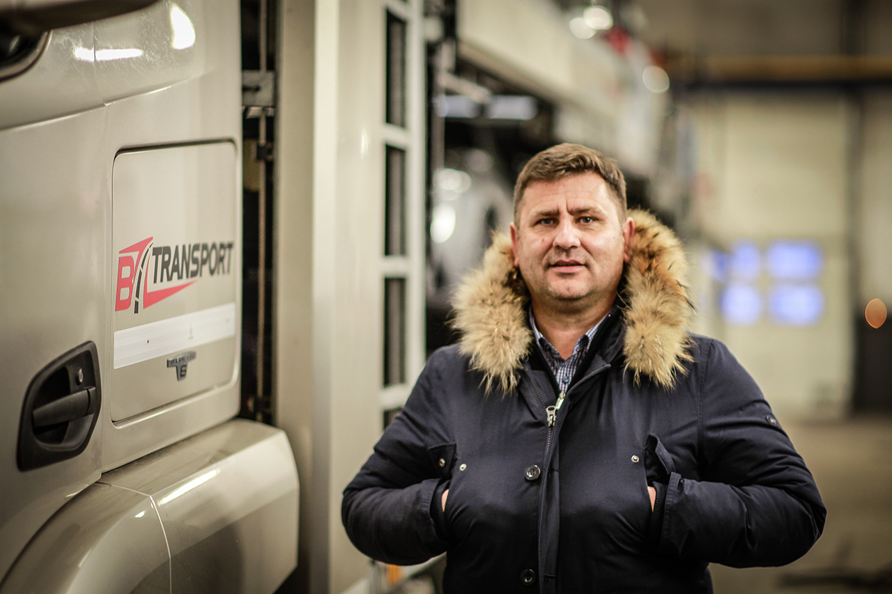 Director Slobodan Okosanović of BZ Transport, Slovenia, next to a truck.