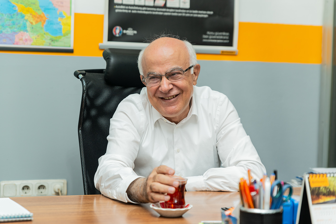 Nesa Lojistik owner Cumhur Şanlı at his desk.